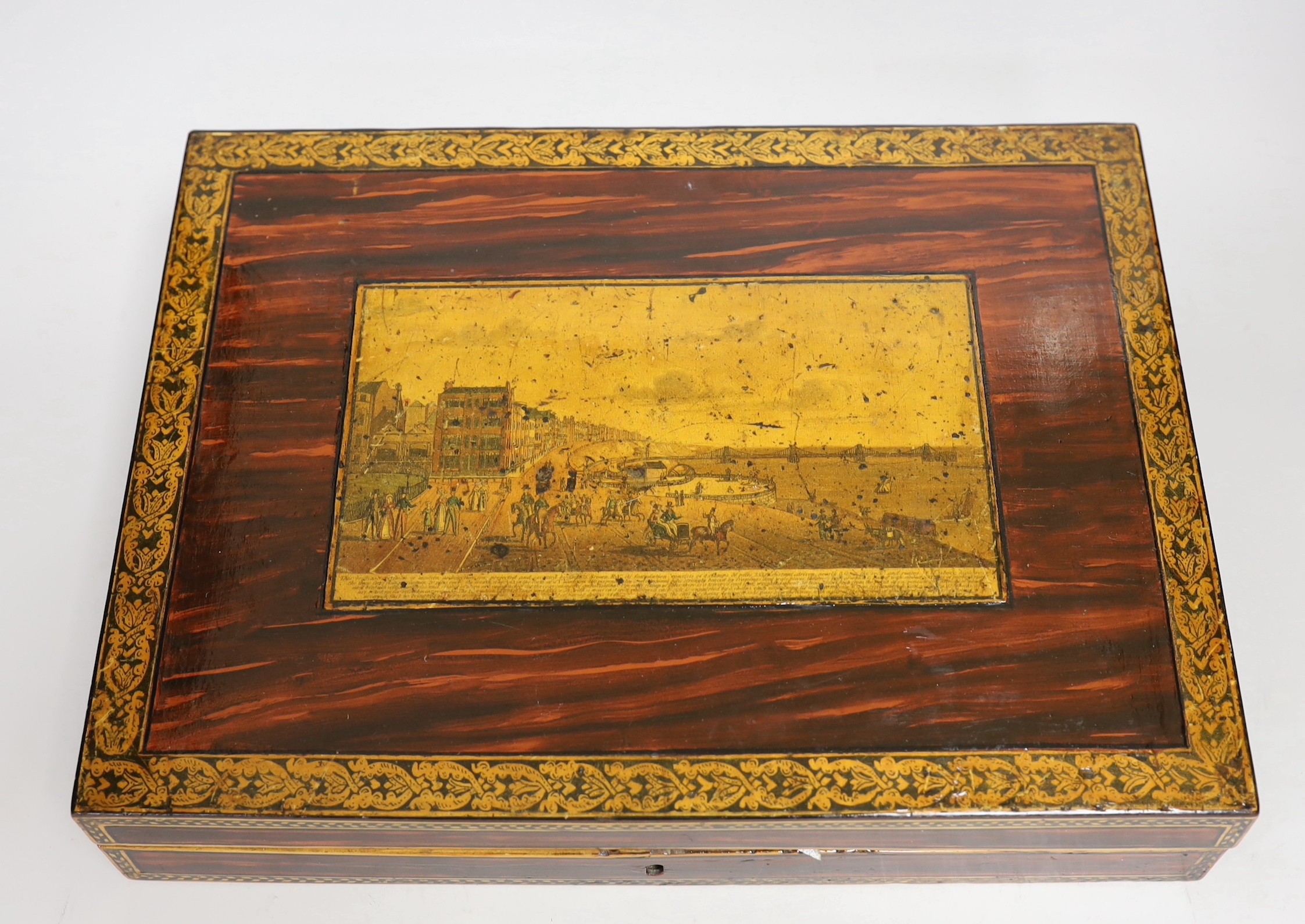 An early Tunbridge ware writing slope decorated with a scene of Brighton seafront and chain-pier to the cover. 36cm wide
